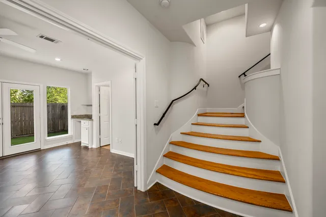 a kitchen with stainless steel appliances granite countertop a sink stove and cabinets