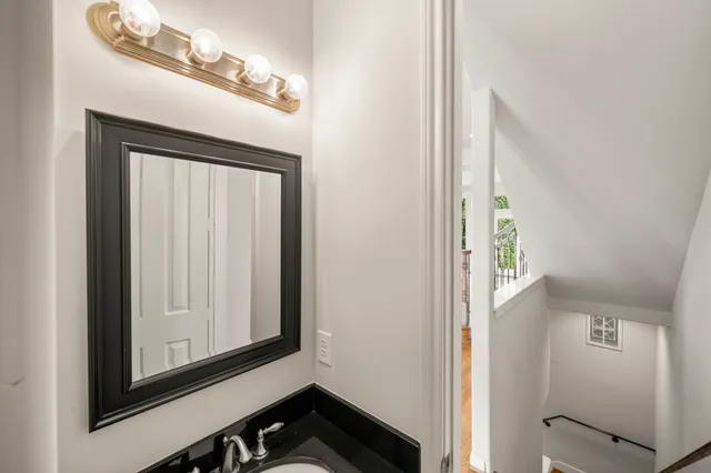 a large kitchen with kitchen island granite countertop a large counter top stainless steel appliances and wooden cabinets