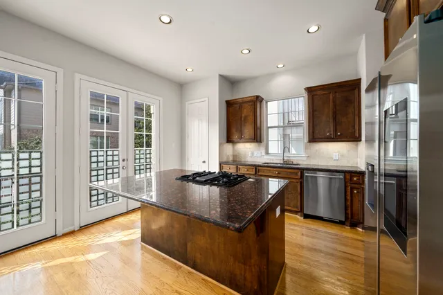 a kitchen that has a stove and a refrigerator