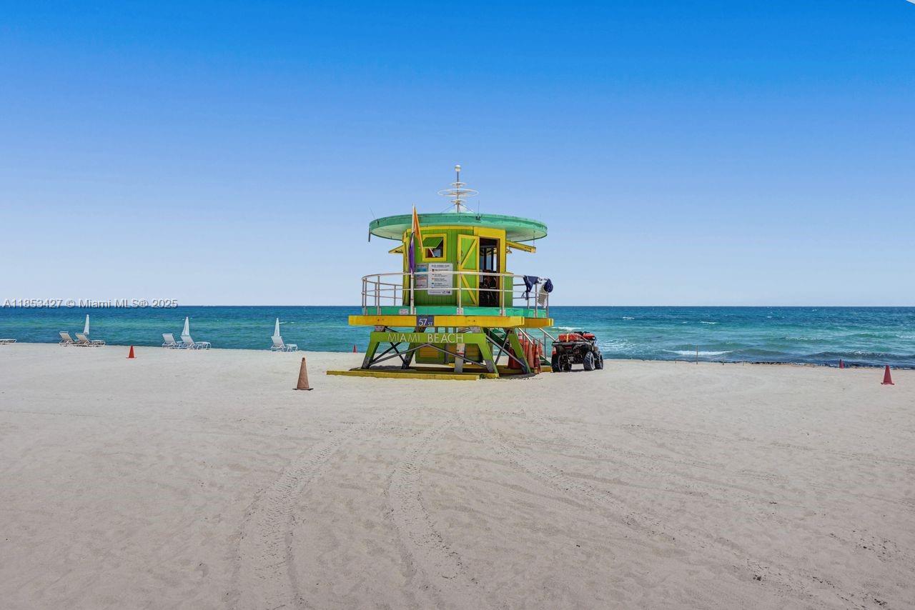 5757 Collins Avenue, Unit 1605 Miami Beach, FL 33140 - Photo 31 of 40 a view of a terrace with a table and chairs