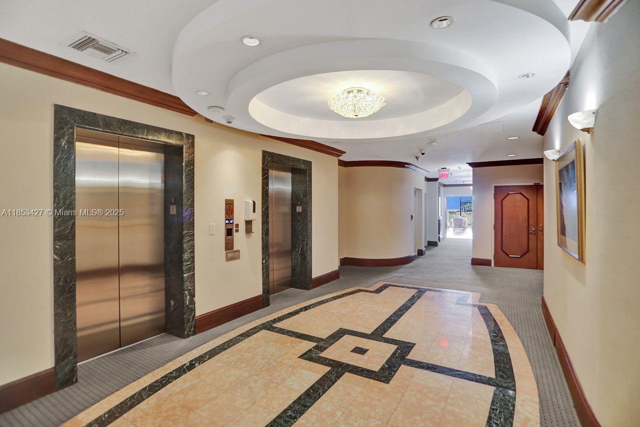 5757 Collins Avenue, Unit 1605 Miami Beach, FL 33140 - Photo 32 of 40 a living room with furniture