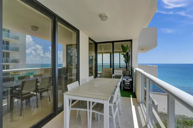 a balcony view with a seating space