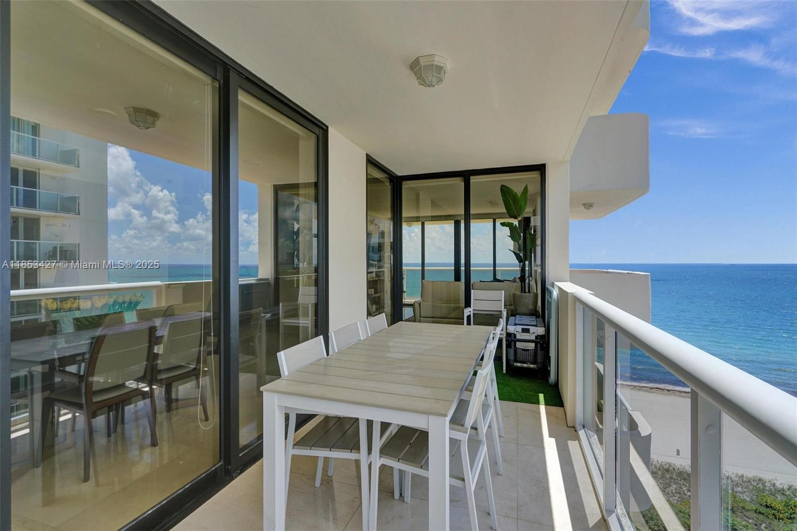 5757 Collins Avenue, Unit 1605 Miami Beach, FL 33140 - Photo 10 of 40 a balcony view with a seating space