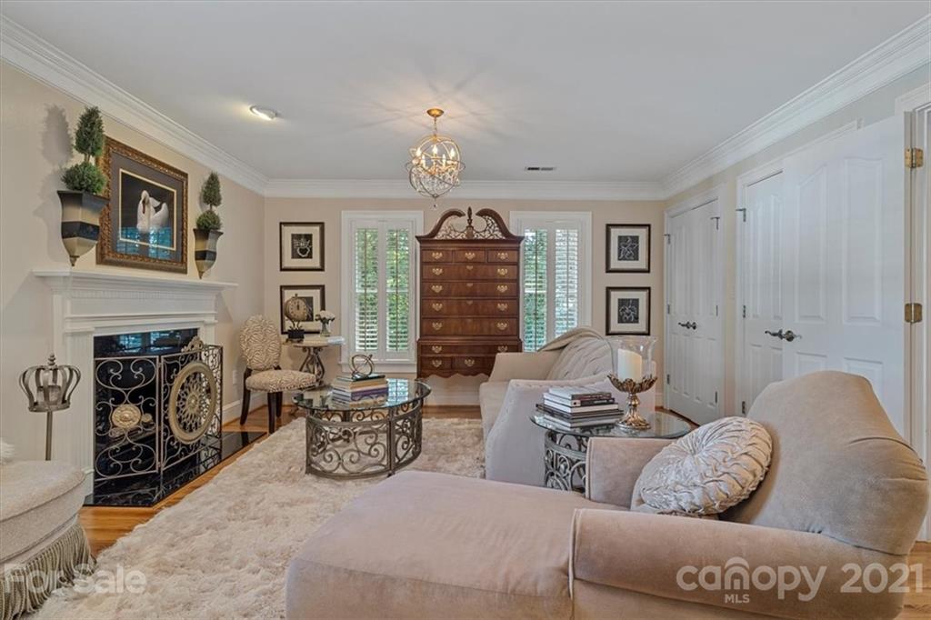 18017 Davidson-Concord Road Davidson, NC 28036 - Photo 22 of 47 a living room with furniture fireplace and a fireplace