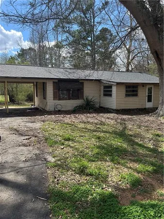 a house with trees in the background
