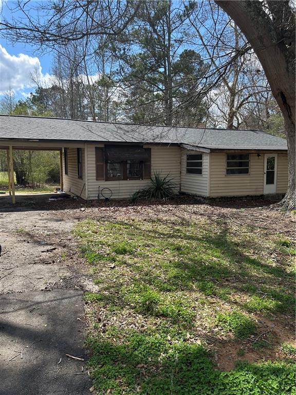 355 Whitfield Drive Dallas, GA 30132 - Photo 1 of 18 a house with trees in the background