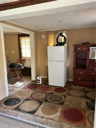 a room with furniture and white wooden closet