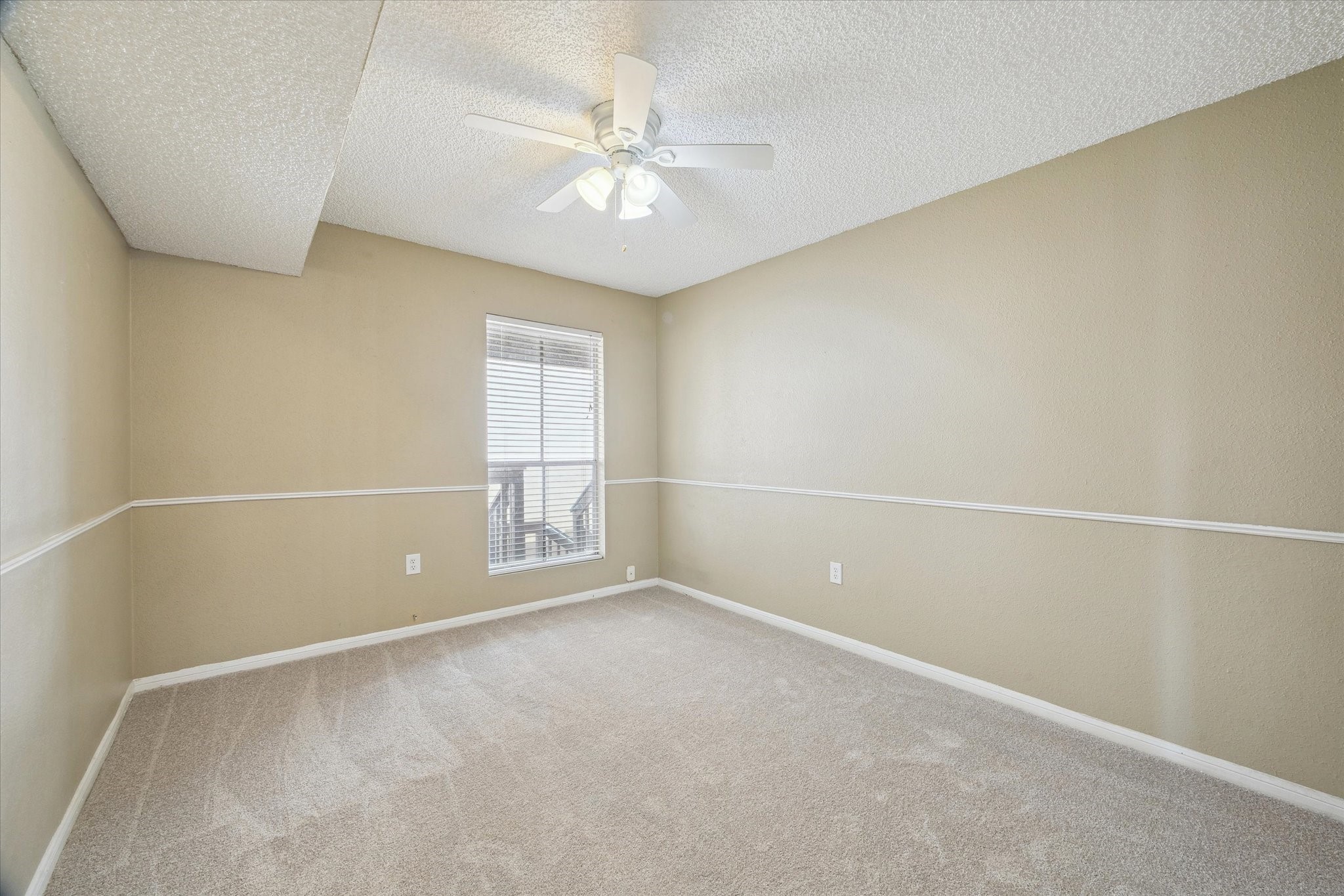 1500 Bay Area Boulevard, Unit 422 Houston, TX 77058 - Photo 8 of 14 an empty room with windows and fan