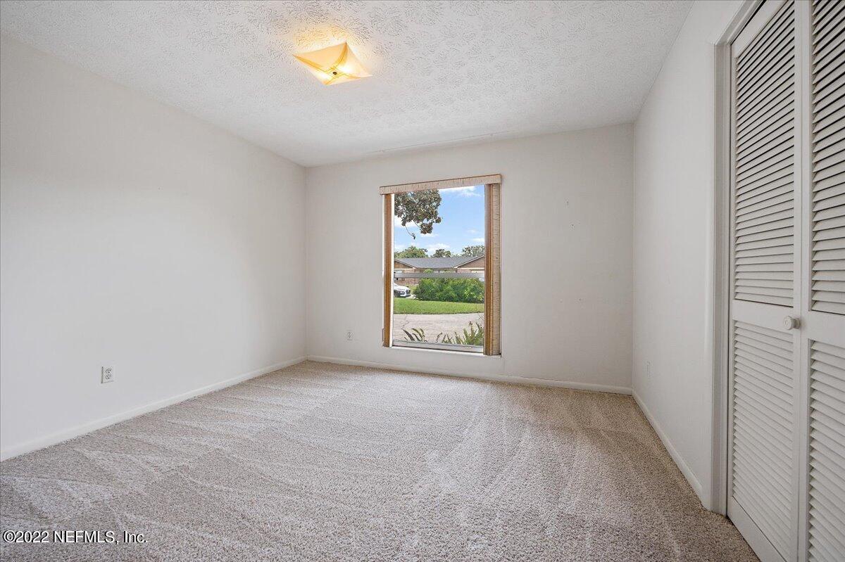 5504 Weaver Road Orange Park, FL 32073 - Photo 11 of 15 an empty room with a window