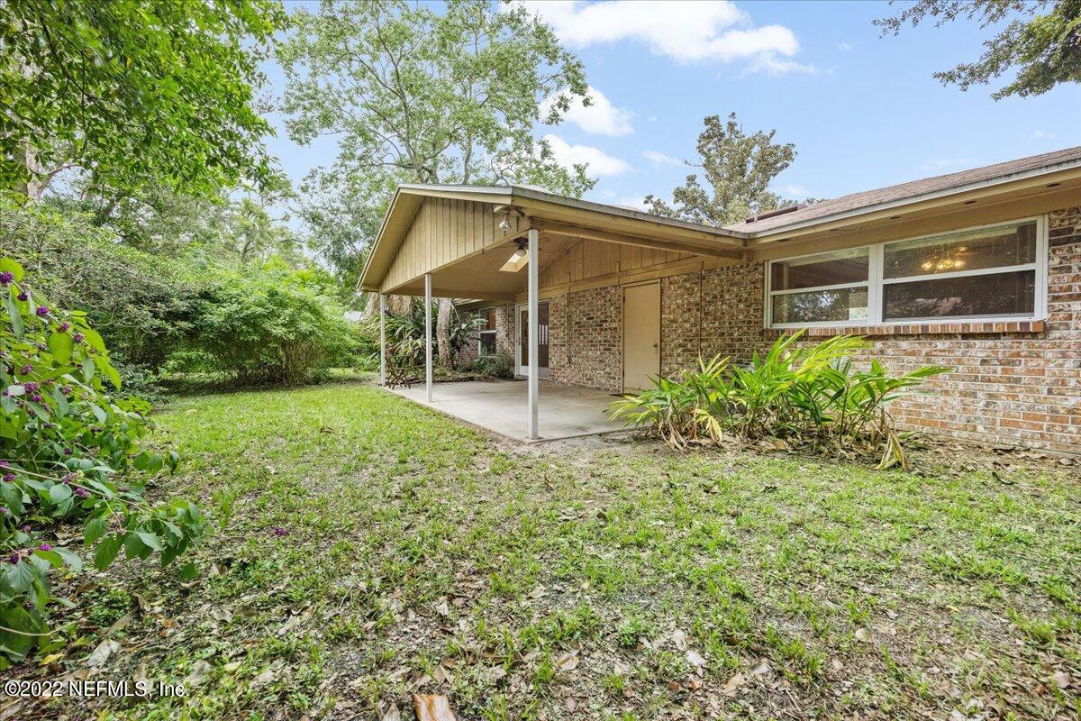5504 Weaver Road Orange Park, FL 32073 - Photo 15 of 15 a view of a house with a yard