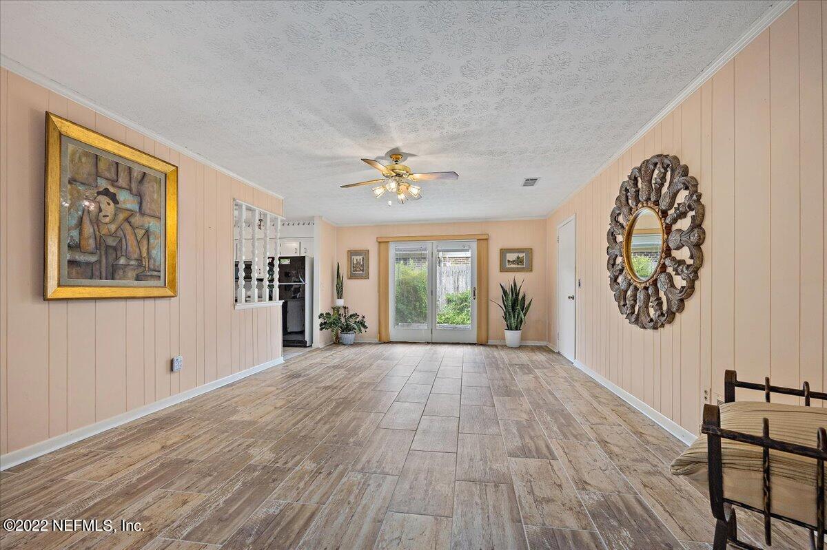 5504 Weaver Road Orange Park, FL 32073 - Photo 4 of 15 a view of an empty room with a window and wooden floor