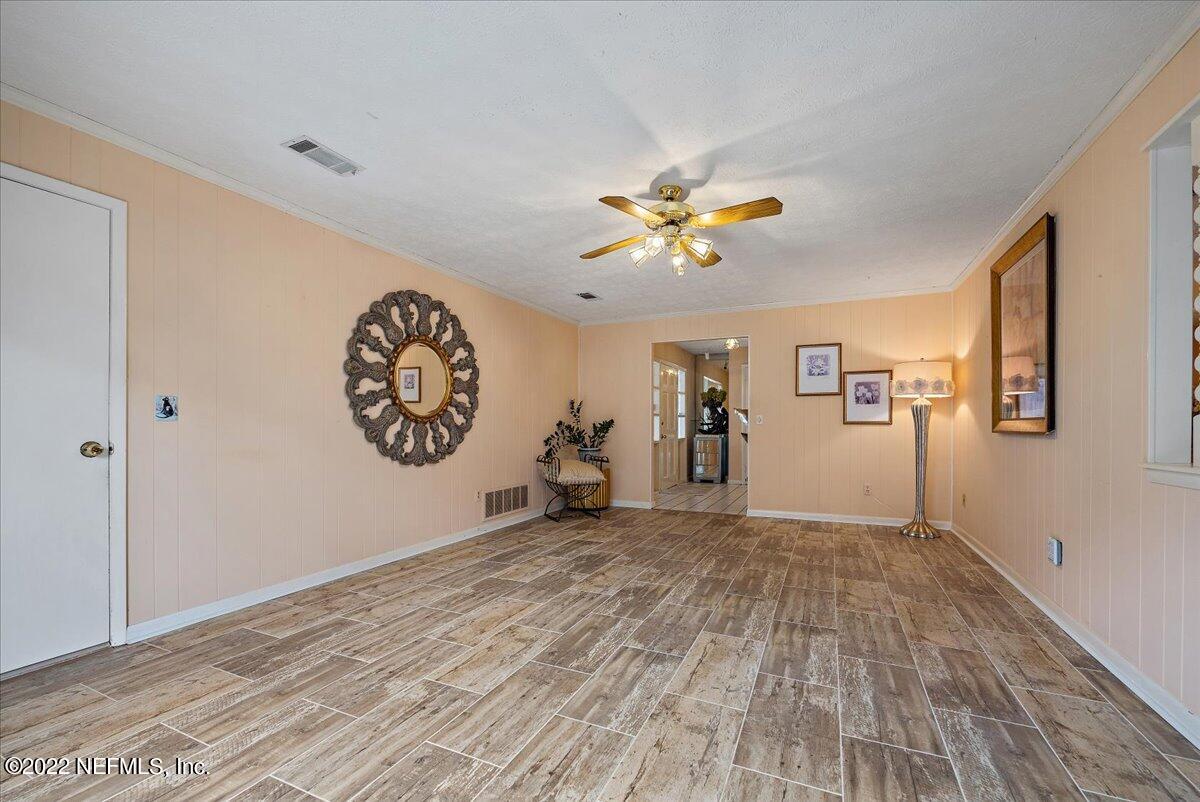 5504 Weaver Road Orange Park, FL 32073 - Photo 5 of 15 a view of a hallway with wooden floor