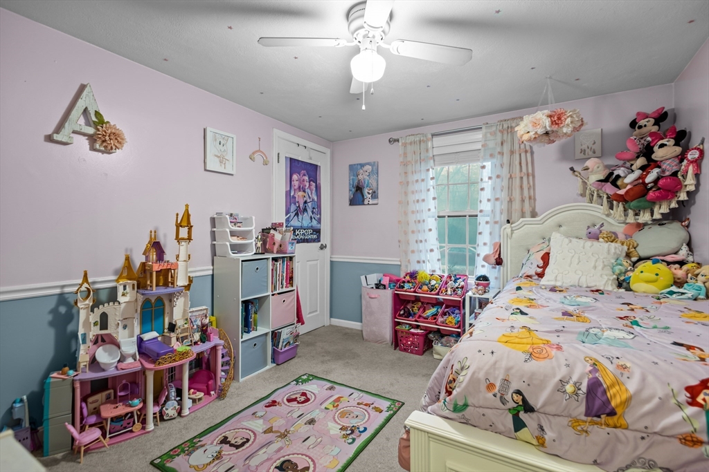 14 Mine Brook Road Rehoboth, MA 02769 - Photo 11 of 40 a bed room with a bed and a baby bed