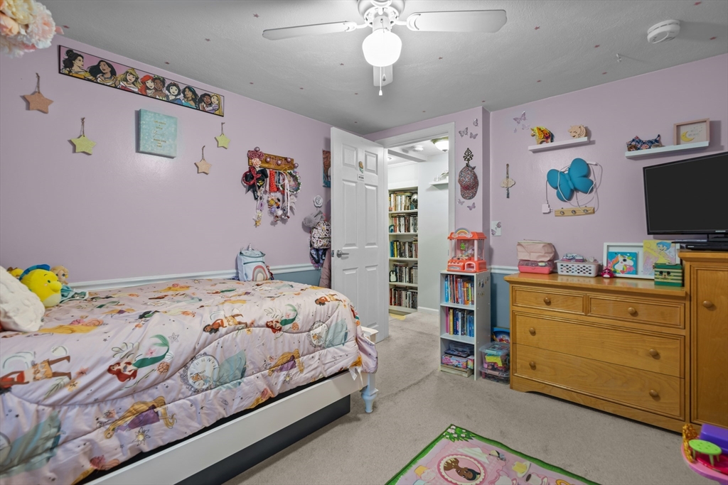 14 Mine Brook Road Rehoboth, MA 02769 - Photo 12 of 40 a bedroom with a bed and a flat tv screen on dresser
