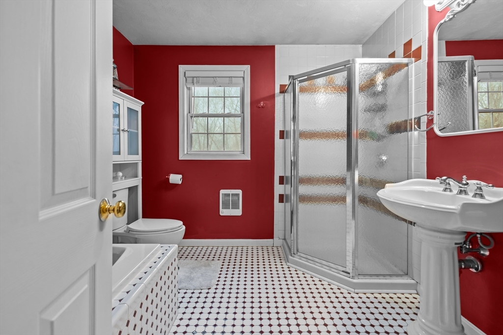 14 Mine Brook Road Rehoboth, MA 02769 - Photo 27 of 40 a bathroom with a sink a toilet a shower and a mirror