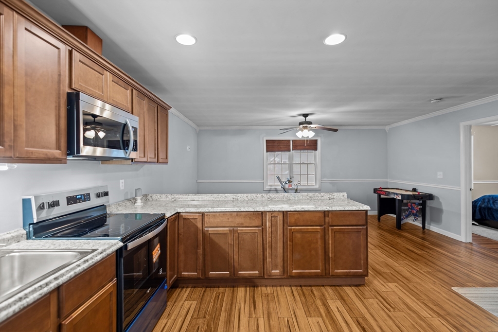 14 Mine Brook Road Rehoboth, MA 02769 - Photo 32 of 40 a kitchen with a sink and cabinets