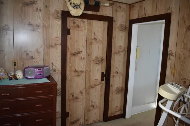 a bathroom with a granite countertop sink a toilet a mirror and shower