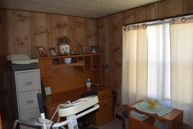 a view of workspace with furniture and a window