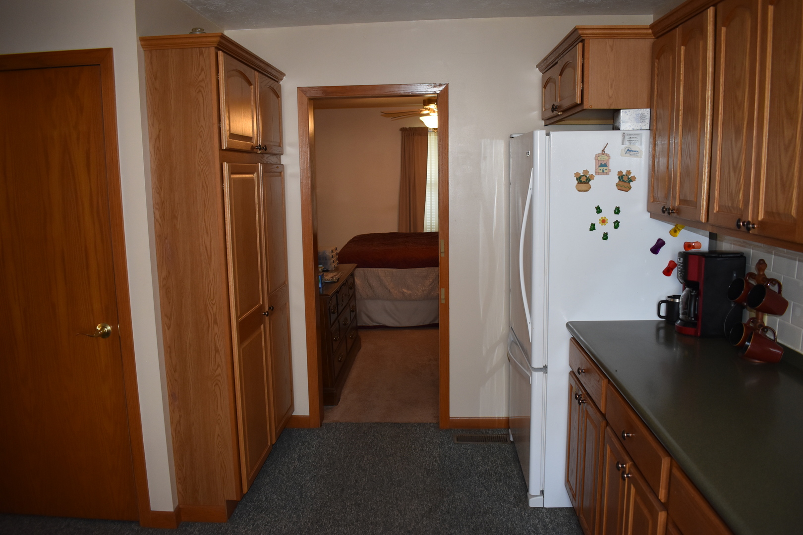 9898 East 1200 N Road Chenoa, IL 61726 - Photo 8 of 50 a kitchen with a refrigerator and a stove