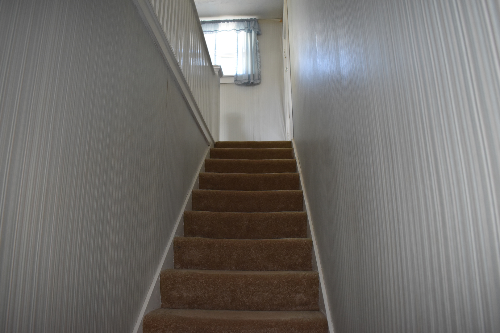 9898 East 1200 N Road Chenoa, IL 61726 - Photo 9 of 50 a view of staircase with white walls and white door