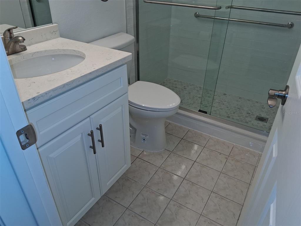 4326 Summersun Drive New Port Richey, FL 34652 - Photo 11 of 28 a bathroom with a sink a toilet and shower