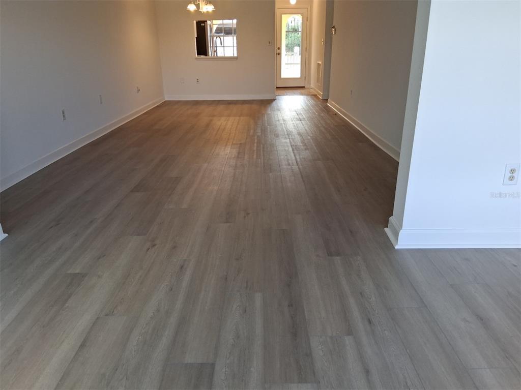 4326 Summersun Drive New Port Richey, FL 34652 - Photo 16 of 28 a view of a room has wooden floor and windows