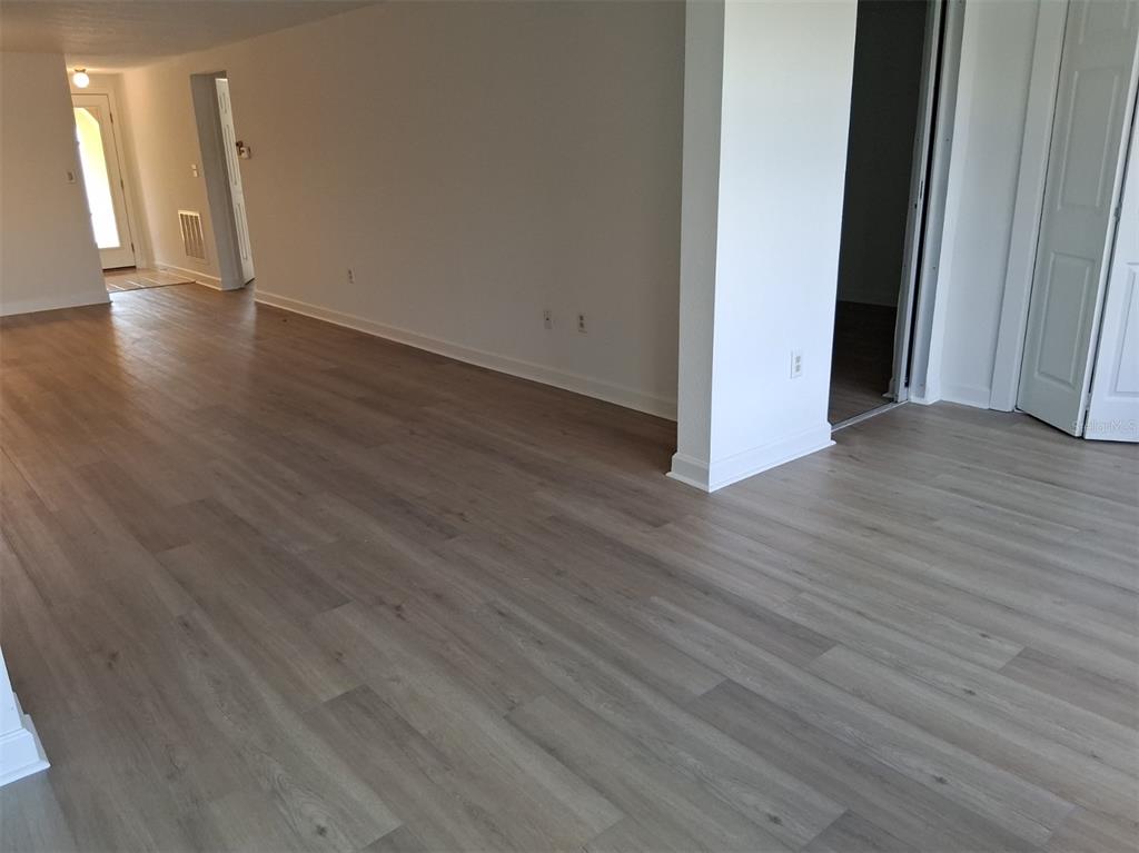 4326 Summersun Drive New Port Richey, FL 34652 - Photo 17 of 28 a view of a hallway with wooden floor