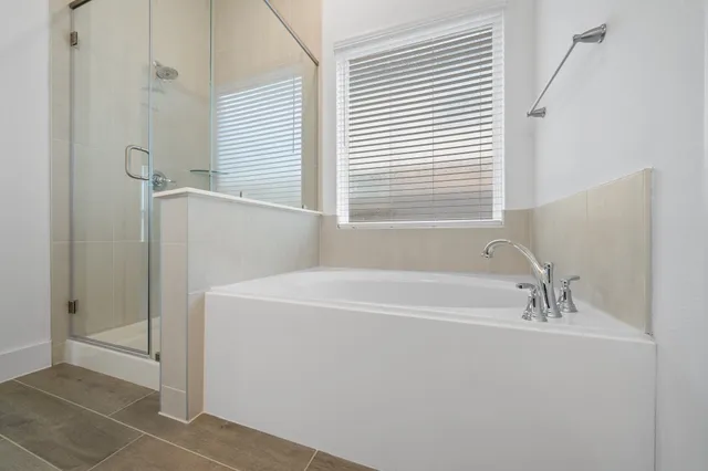 a white bath tub sitting next to a white sink
