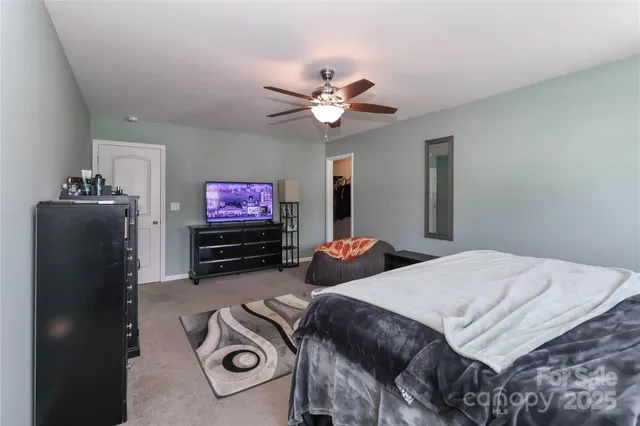 a bathroom with a double vanity sink toilet mirror and shower