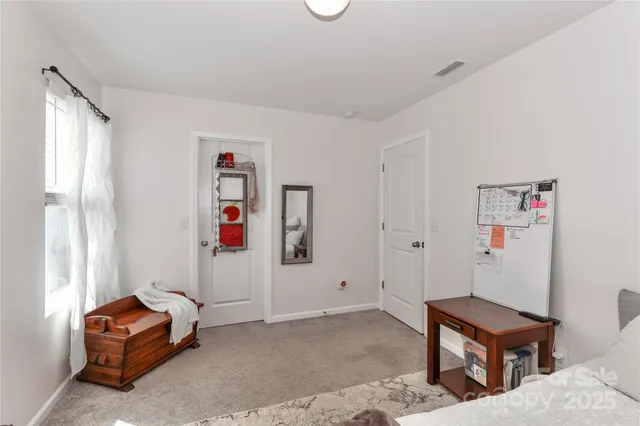 a bathroom with a sink toilet vanity and shower