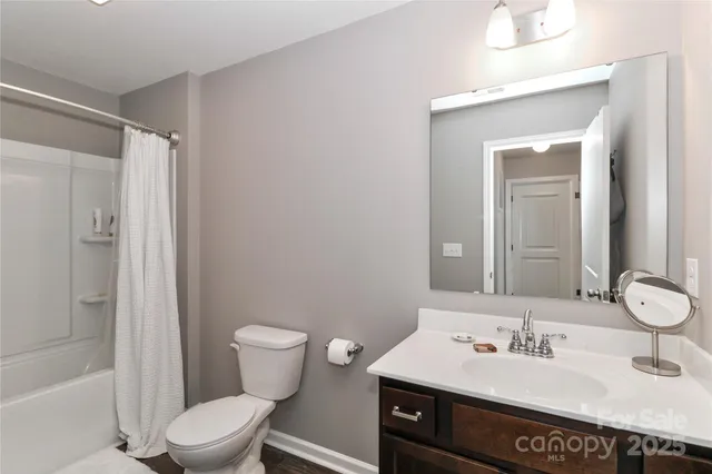 a bedroom with a bed and lamp