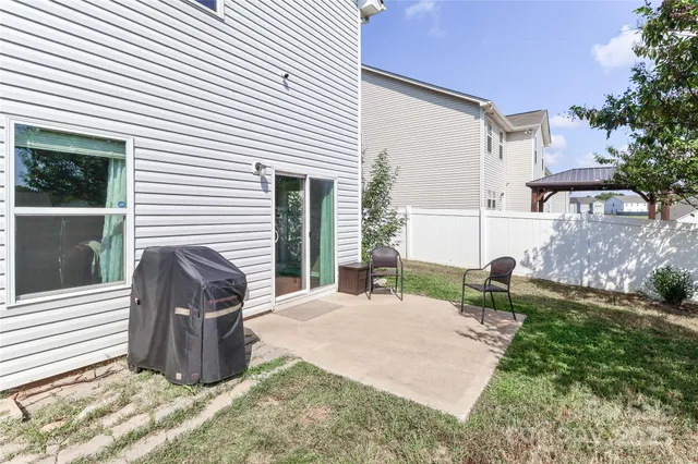 a view of a house with a tree