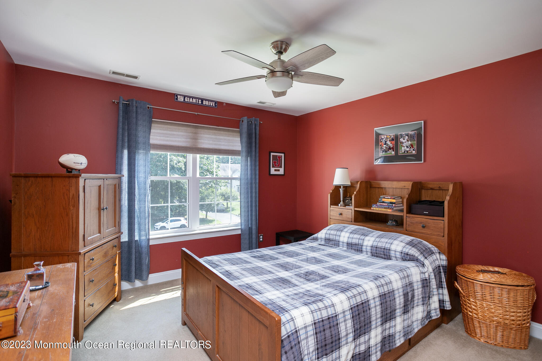 68 Erin Drive Jackson, NJ 08527 - Photo 19 of 40 a bedroom with a bed and a chandelier