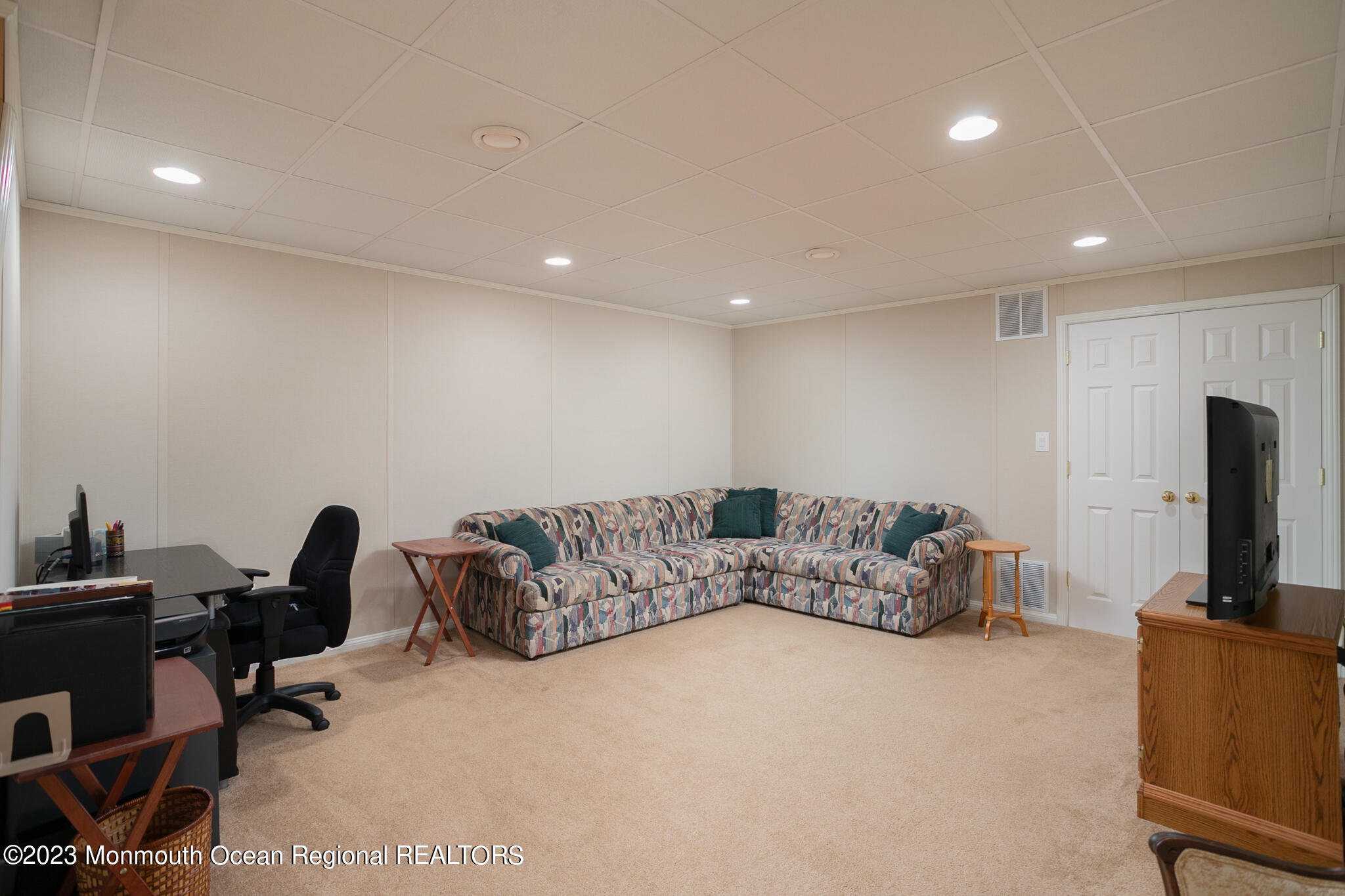 68 Erin Drive Jackson, NJ 08527 - Photo 29 of 40 a living room with furniture and a flat screen tv