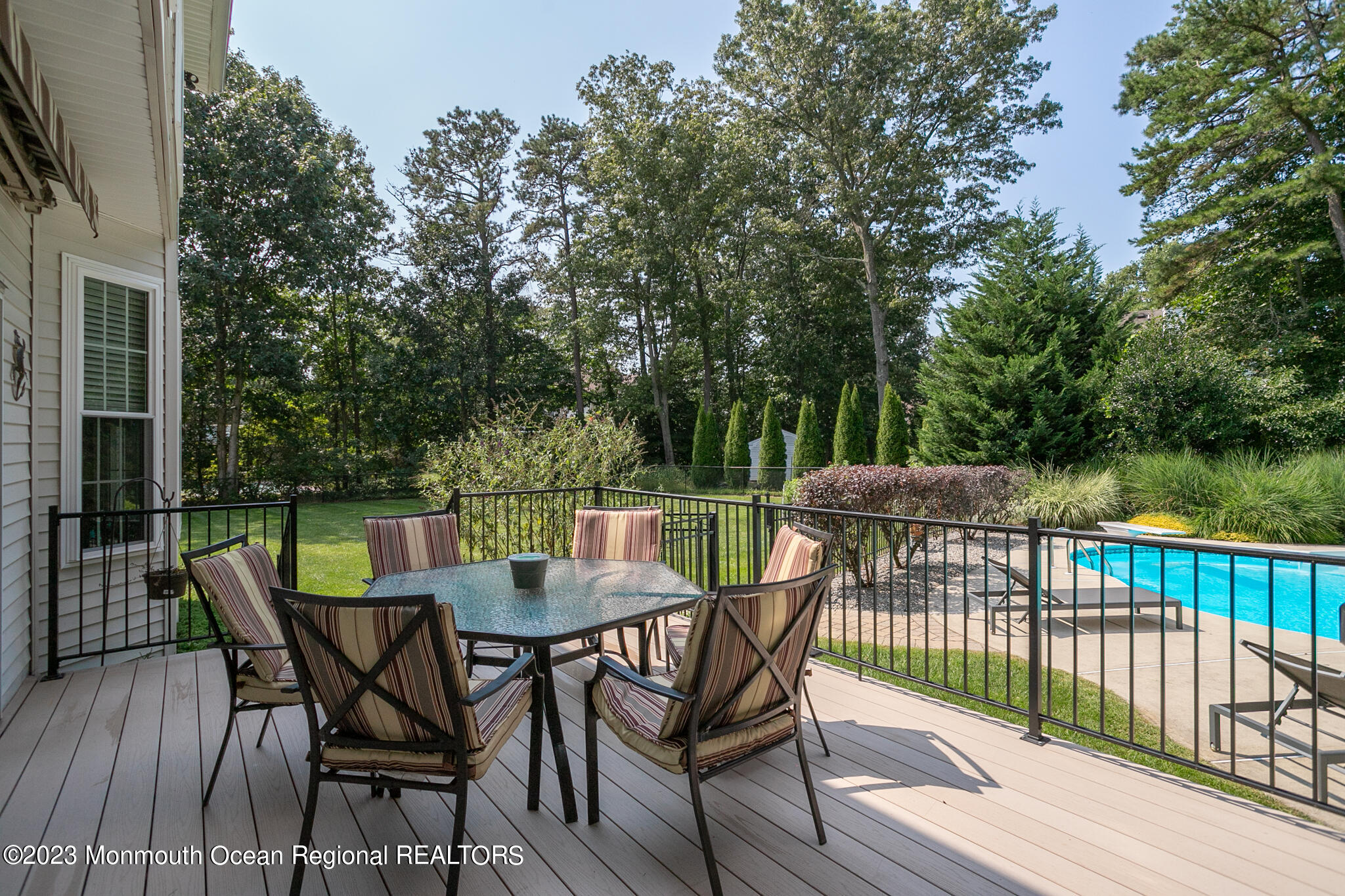 68 Erin Drive Jackson, NJ 08527 - Photo 30 of 40 a view of a chairs and table on the deck