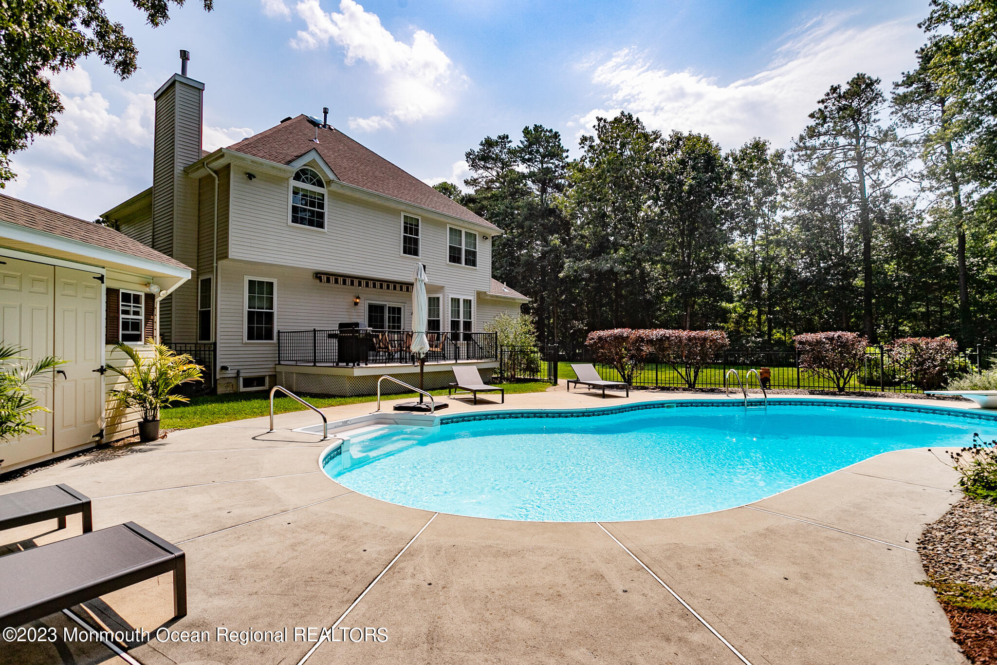 68 Erin Drive Jackson, NJ 08527 - Photo 31 of 40 a view of a swimming pool with chairs
