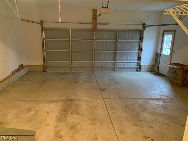 1899 Haines Road Madison, OH 44057 - Photo 34 of 44 Garage featuring a garage door opener