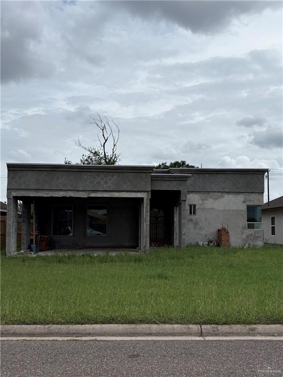 3716 Canan Street Weslaco, TX 78596 - Photo 1 of 5 Exterior featuring a stucco finish, a covered entry, and a front yard