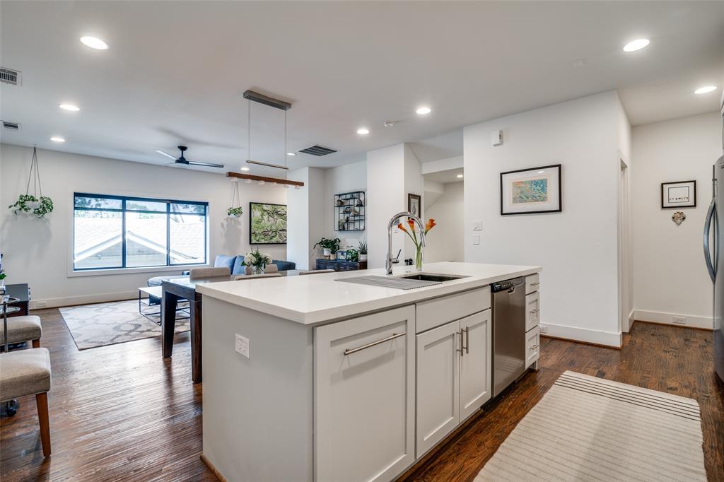 5602 Lindell Avenue, Unit B Dallas, TX 75206 - Photo 12 of 29 a kitchen with center island and stainless steel appliances