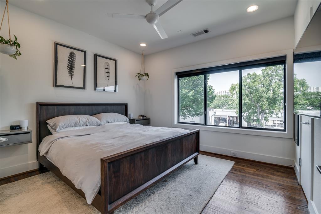 5602 Lindell Avenue, Unit B Dallas, TX 75206 - Photo 14 of 29 a bedroom with a large bed and a large window