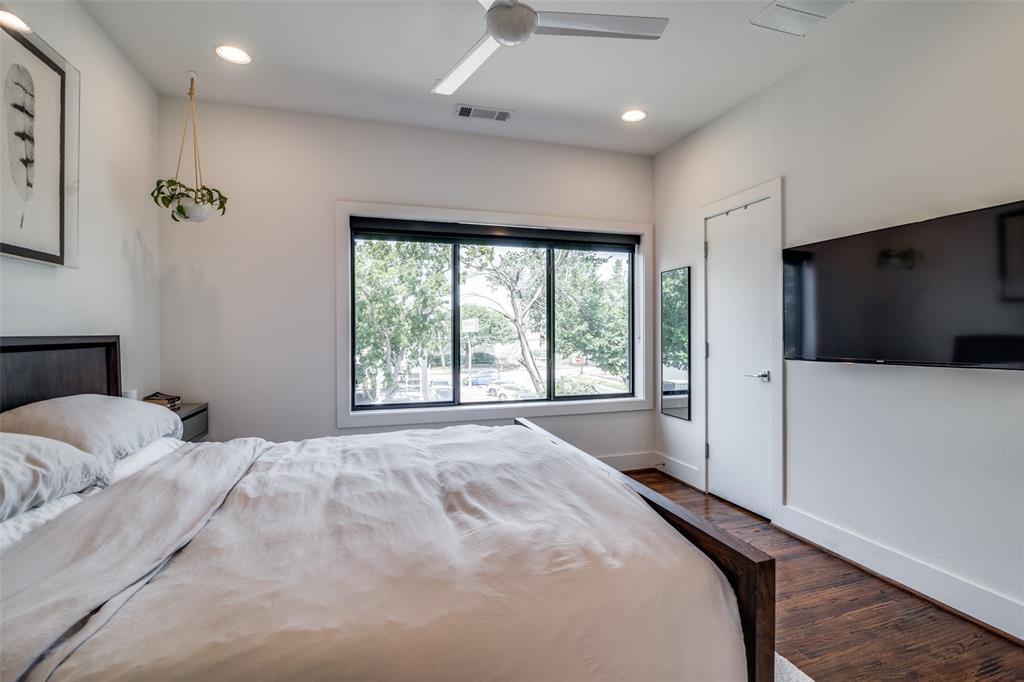 5602 Lindell Avenue, Unit B Dallas, TX 75206 - Photo 16 of 29 a large bedroom with a large bed and a large window