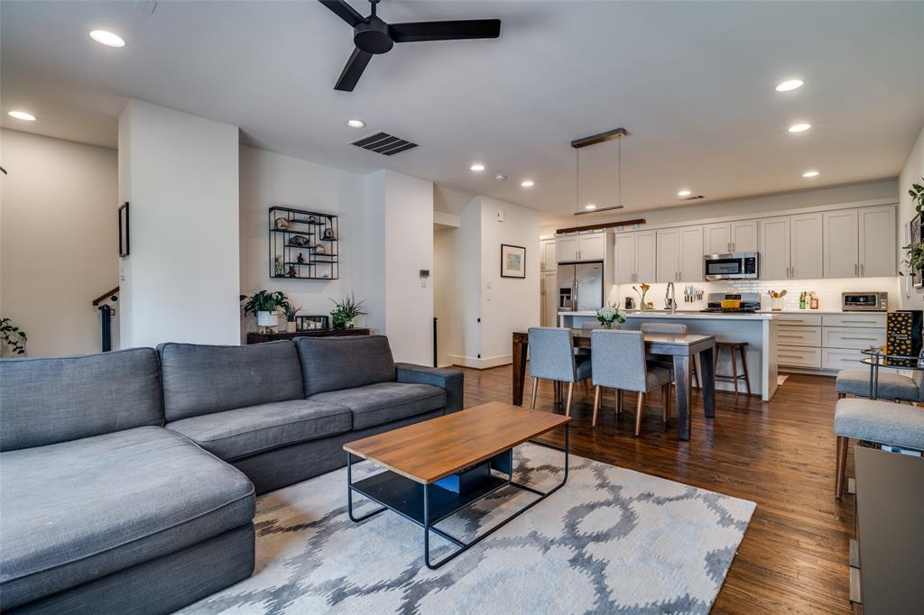 5602 Lindell Avenue, Unit B Dallas, TX 75206 - Photo 9 of 29 a living room with furniture a kitchen view and a potted plant