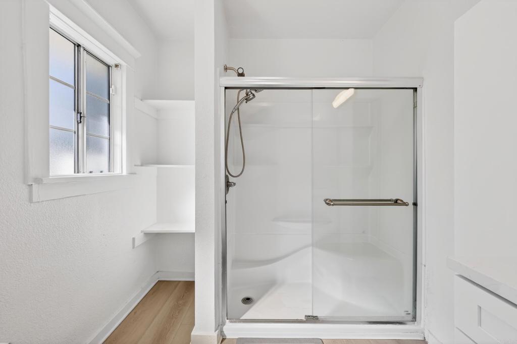 1530 East Appleton Street Long Beach, CA 90802 - Photo 41 of 61 a bathroom with a glass shower door
