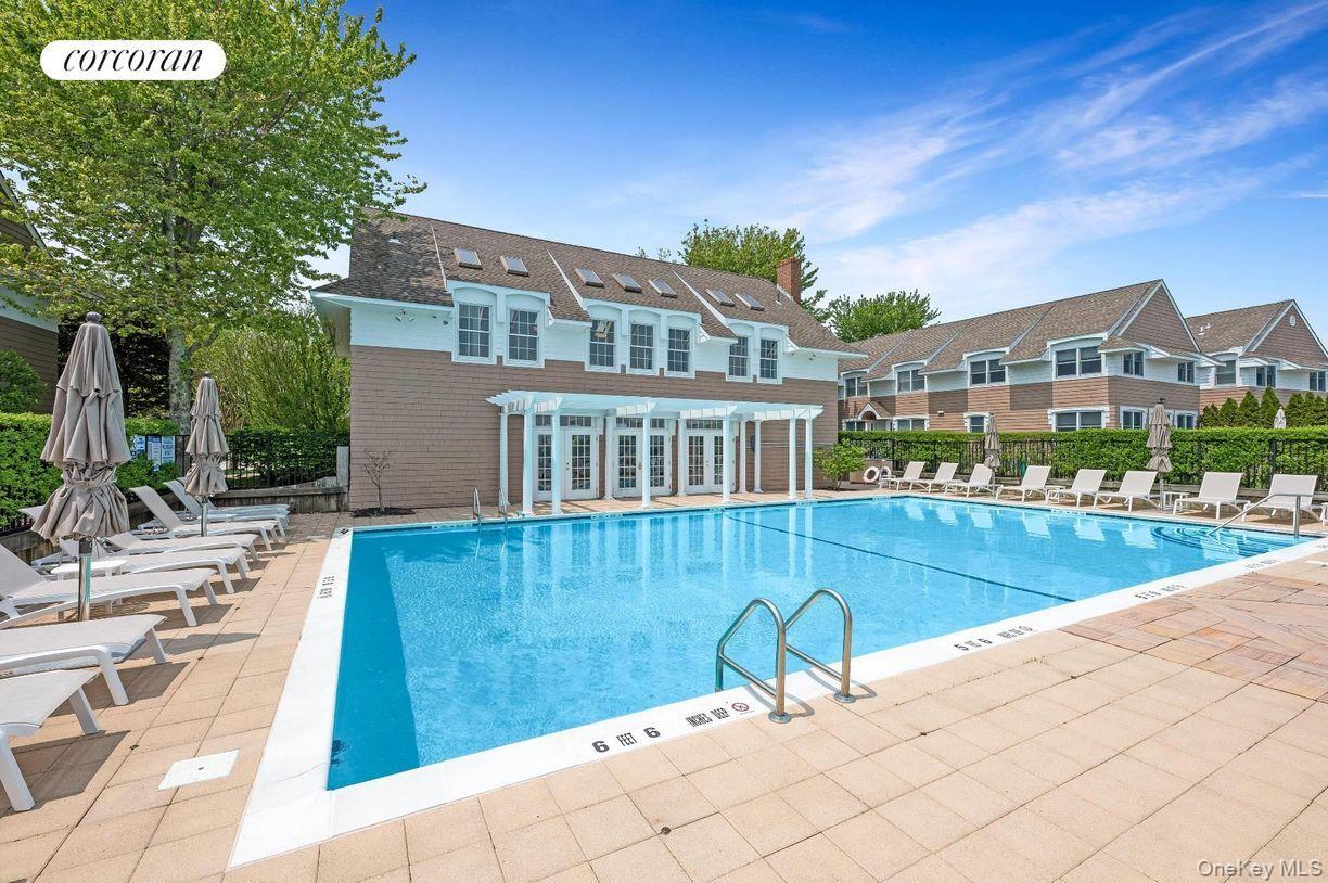 49 Canoe Place Road, Unit 312 Hampton Bays, NY 11946 - Photo 11 of 12 a view of a house with backyard and sitting area