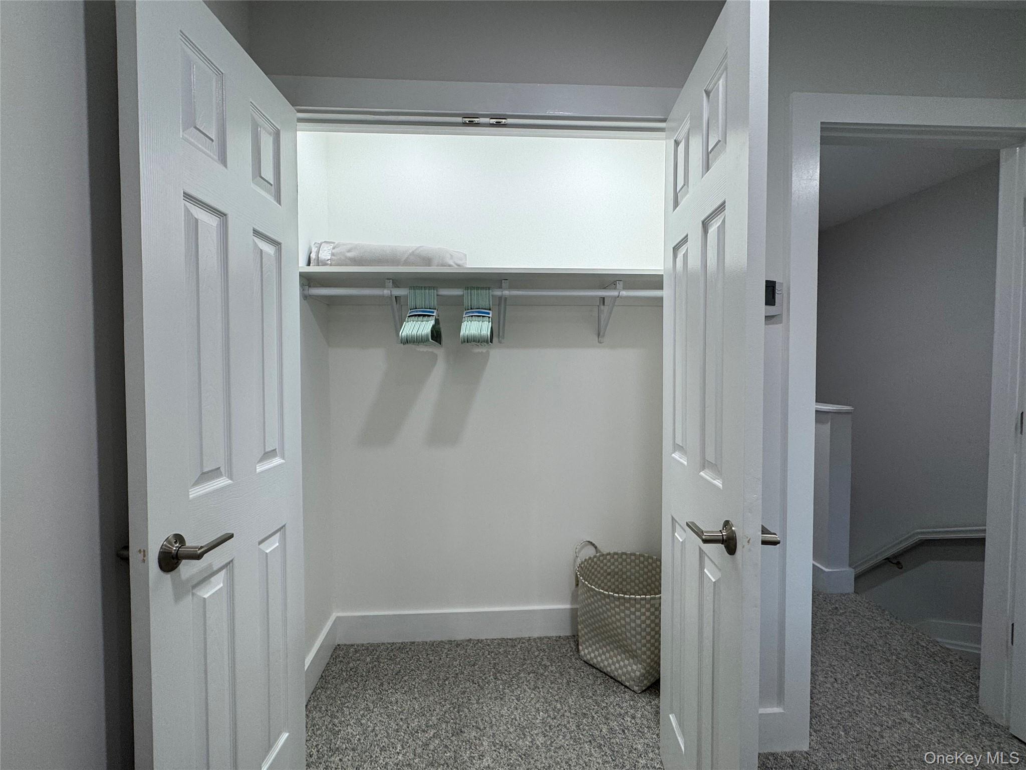 49 Canoe Place Road, Unit 312 Hampton Bays, NY 11946 - Photo 4 of 12 a view of an empty room