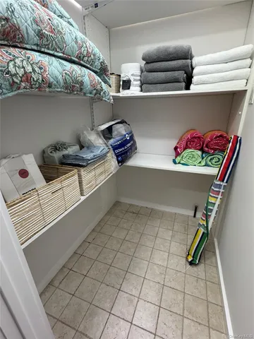 a bathroom with a granite countertop sink toilet a mirror and shower