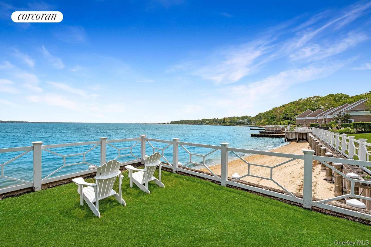49 Canoe Place Road, Unit 312 Hampton Bays, NY 11946 - Photo 10 of 12 a view of an outdoor space with seating area