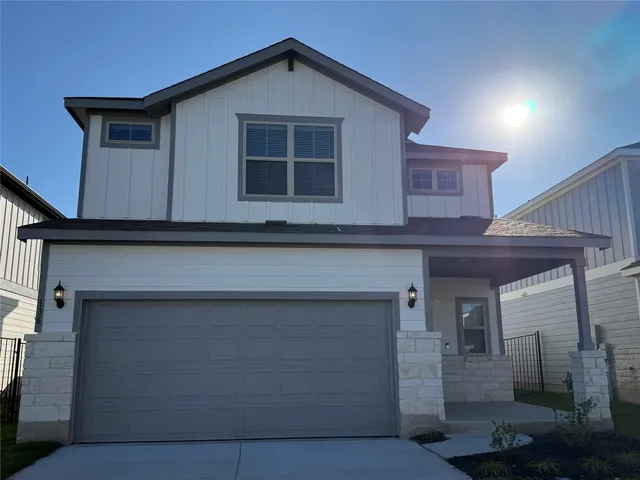 a view of a house with garage