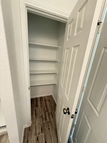 a bathroom with a glass door shower