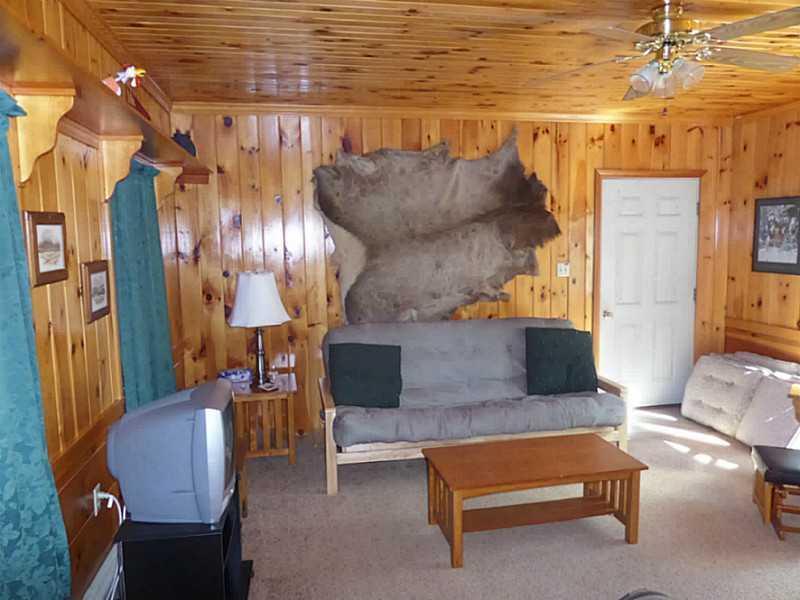 73 Oak Shore Road Harrison, ME 04040 - Photo 13 of 35 Den. den off kitchen, and door to...